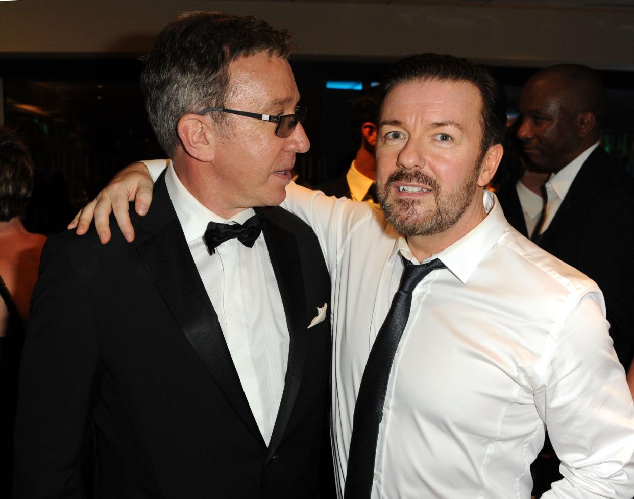 Tim Allen (left) and Ricky Gervais (right) pose wearing black tie attire