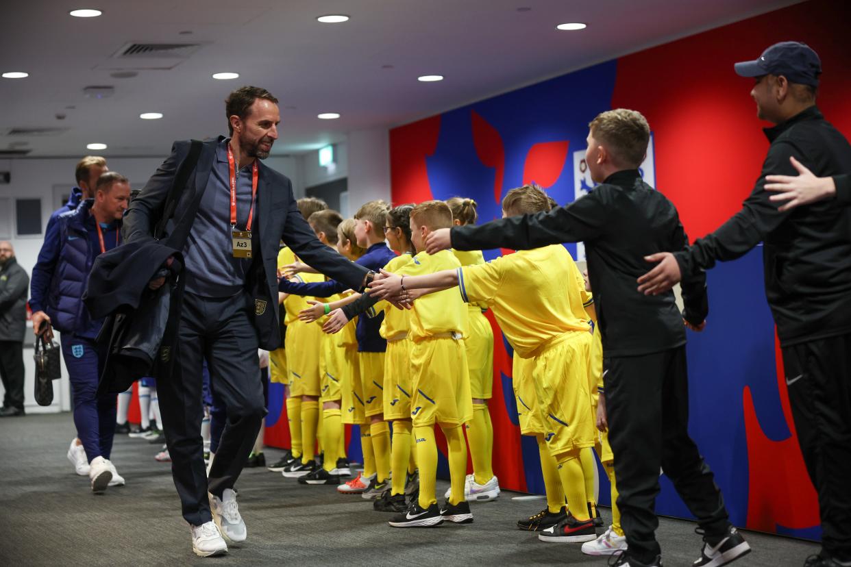Gareth Southgate high-fives Ukraine mascots at Wembley (The FA via Getty Images)