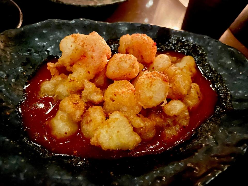 Rock shrimp tempura with a gochujang and bloody mary sauce is among the Asian-inspired dishes at Stories on High, atop the Hilton Columbus Downtown in the Short North.