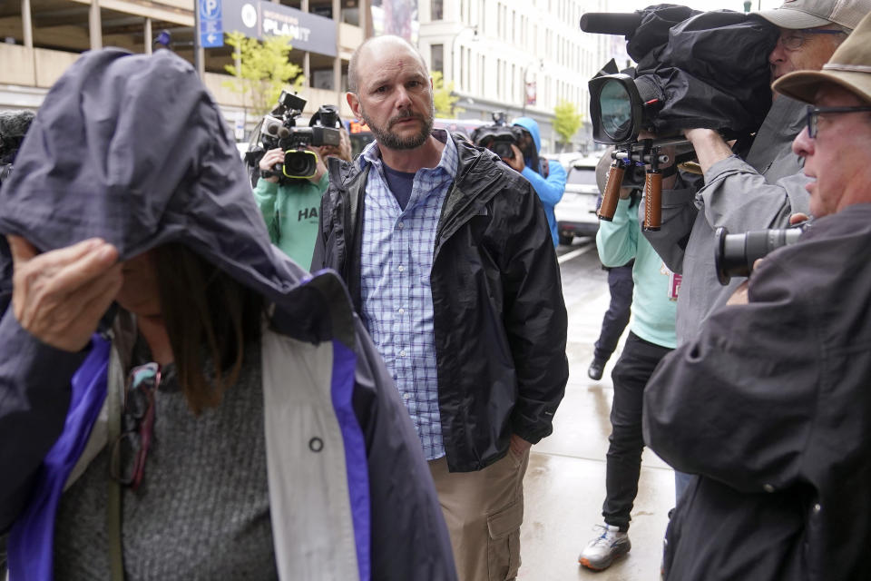 ADDS ID - Jack Michael Teixeira, center, father of Massachusetts Air National Guardsman Jack Teixeira, arrives at federal court, Thursday, April 27, 2023, in Worcester, Mass. Jack Teixeira has been charged with leaking highly classified military documents. Teixeira has been charged under the Espionage Act with unauthorized retention and transmission of classified national defense information. (AP Photo/Steven Senne)