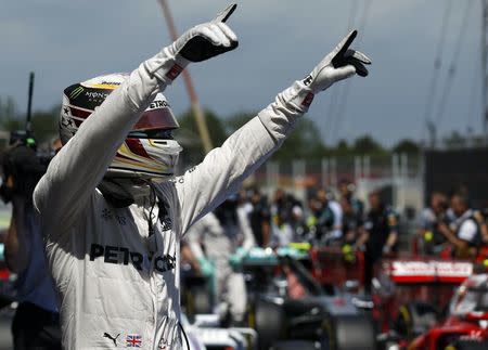 Formula One - Spanish Grand Prix - Barcelona-Catalunya racetrack, Montmelo, Spain - 14/5/16 Mercedes F1 driver Lewis Hamilton of Britain celebrates pole position. REUTERS/Albert Gea