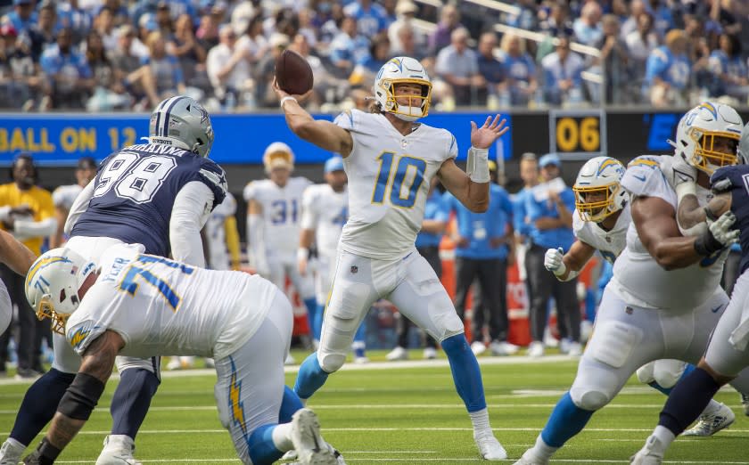 Chargers quarterback Justin Herbert passes against the Dallas Cowboys on Sept. 19, 2021.