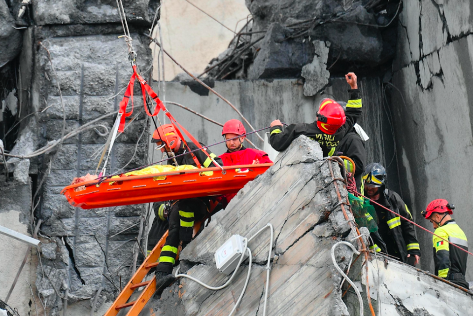 <em>Rescue workers pull an injured person out of the rubble (AP)</em>