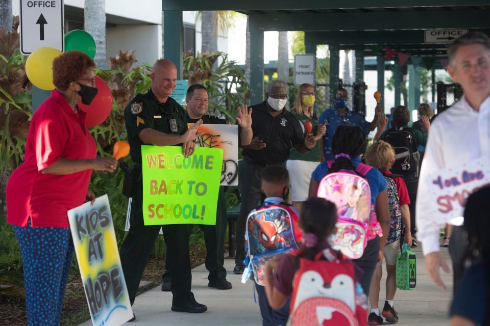 With a round of cheers and encouragement each time a child passed by, St. Lucie County law enforcement, school district staff and board members, and Rivers Edge Elementary School staff welcomed students back for the first day of school during the annual Tunnel of Hope on Tuesday, Aug. 10, 2021, in Port St. Lucie. 