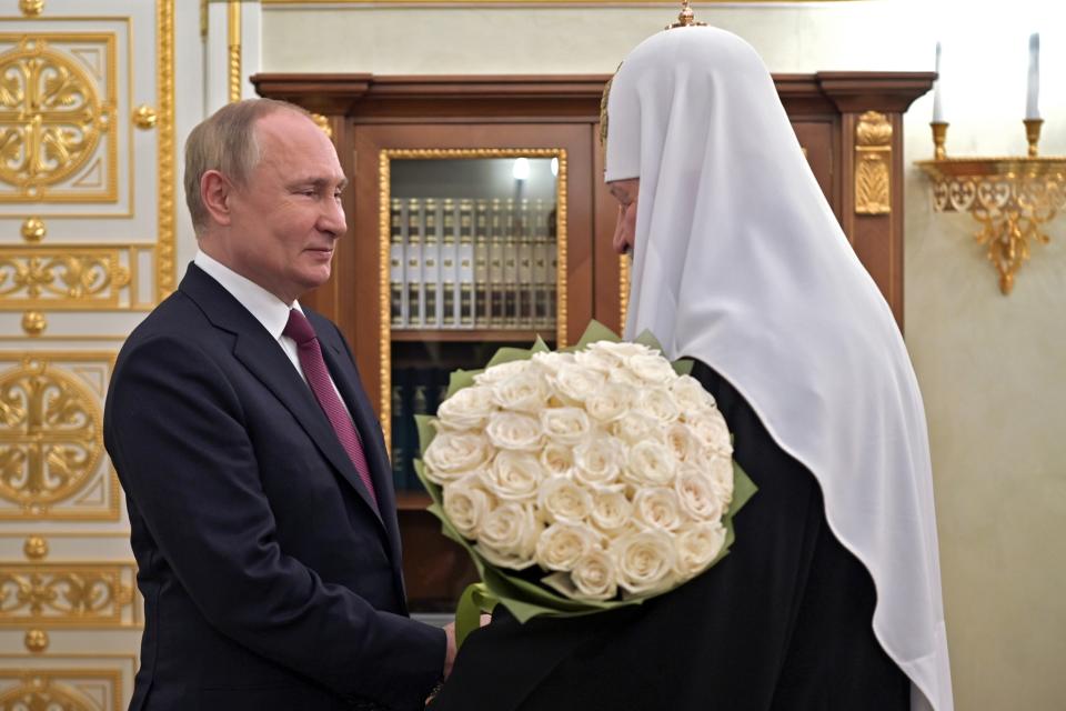 FILE - Russian President Vladimir Putin congratulates Russian Orthodox Church Patriarch Kirill on the 13th anniversary of his enthronement in Moscow, Russia, Tuesday, Feb. 1, 2022. (Alexei Nikolsky, Sputnik, Kremlin Pool Photo via AP)