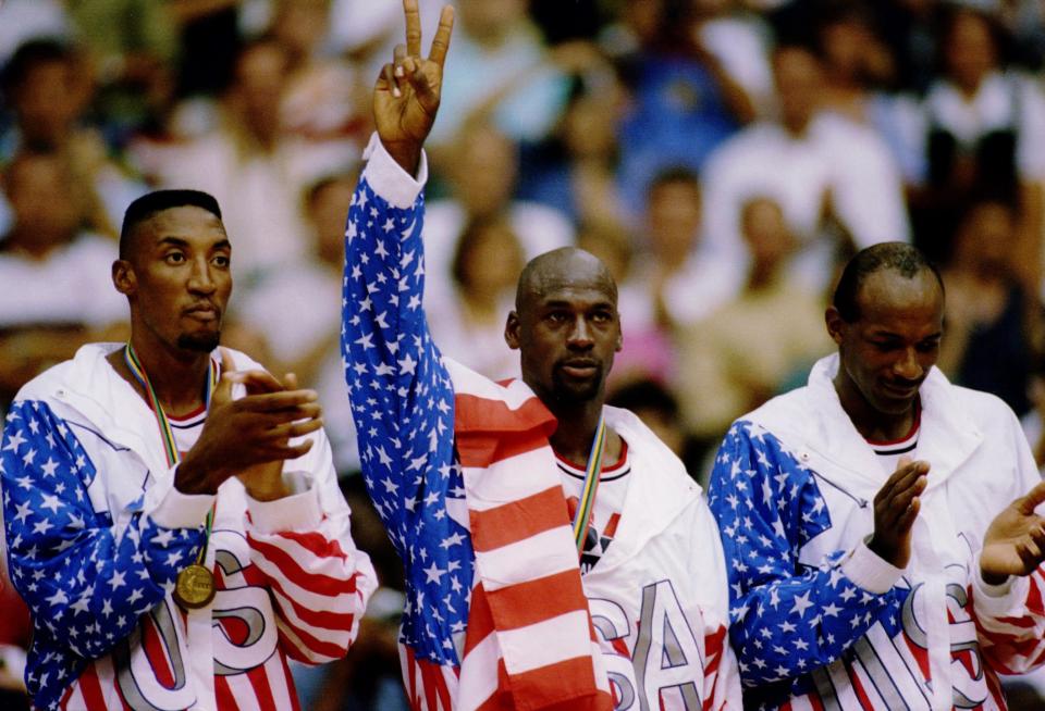 USA Basketball team members Scottie Pippen, left, Michael Jordan, center and Clyde Drexler receive their gold medals at the Barcelona games.