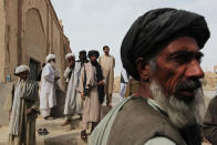 <p>Tribal elders and mullahs from both Pashtun and Balouchi tribes prevalent in southern Helmand province gather after praying together at a rural mosque March 12, 2010 in Khan Neshin in Helmand Province, Afghanistan. A group of local tribal and religious leaders were brought together to a nearby US Marine base for a shura meeting between themselves and American troops, and then afterward gathered in the local mosque to pray. (Photo by Chris Hondros/Getty Images) </p>