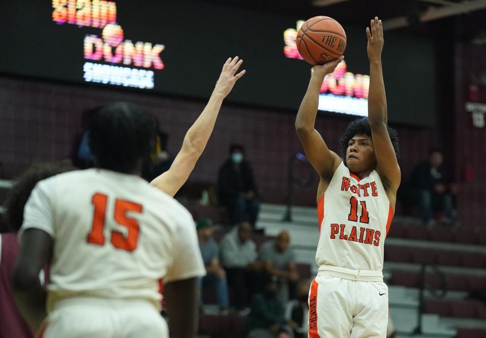 White Plains' Menzy Carden (11) puts a shot against Kingston in the Slam Dunk Classic Showcase basketball tournament at Iona University in New Rochelle on Saturday, January 7, 2023.