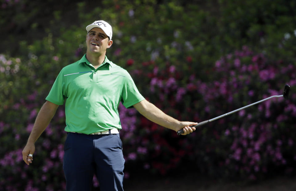 Gary Woodland reacts after missing an eagle on the 13th hole during the second round of the Masters golf tournament Friday, April 11, 2014, in Augusta, Ga. (AP Photo/David J. Phillip)