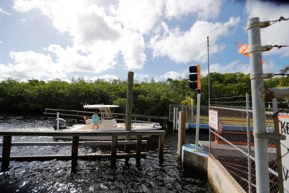 A boat makes its way through the Chiquita Locks in Cape Coral Friday, October23, 2020. 