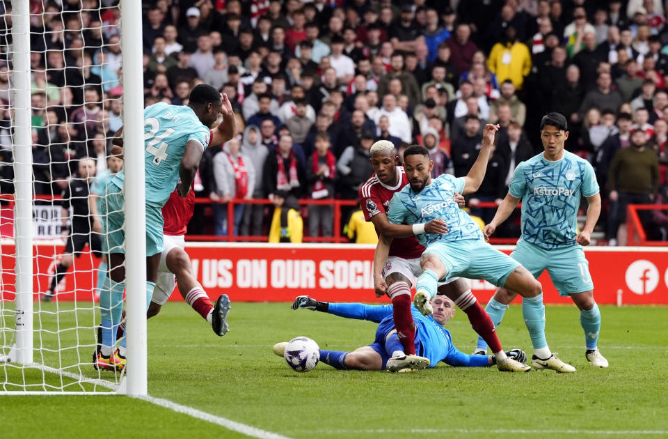 Wolverhampton Wanderers' Matheus Cunha scores his side's second goal of the game during the Premier League soccer match between Nottingham Forest and Wolverhampton Wanderers at the City Ground, in Nottingham, England, Saturday April 13, 2024. (Nick Potts/PA via AP)