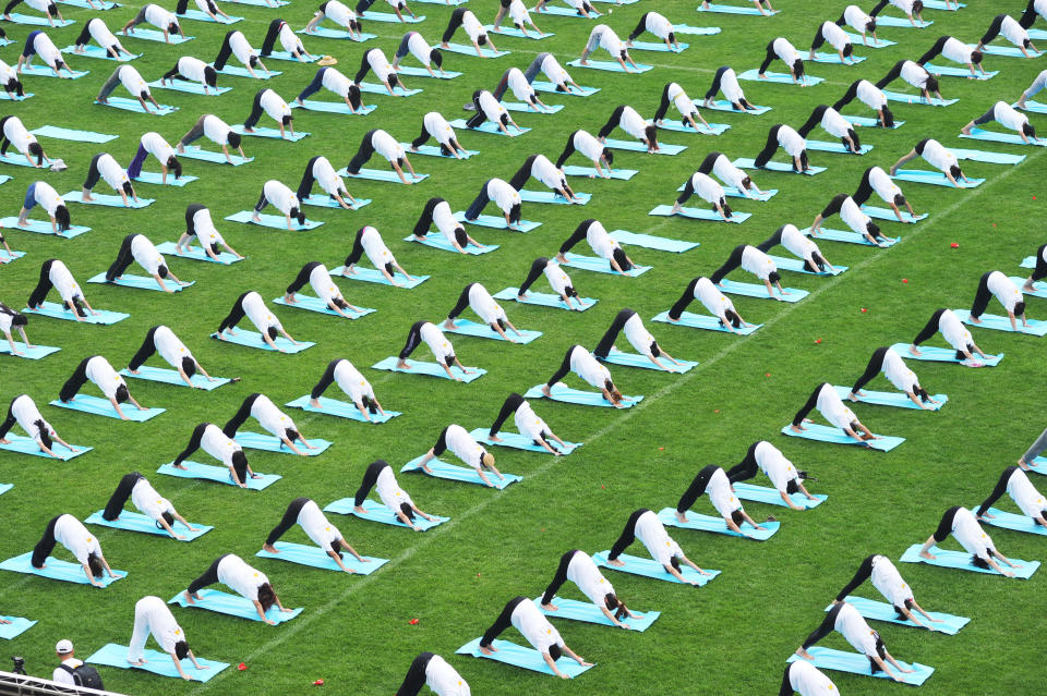 Students take part in a mass yoga session to mark the first International Day of Yoga at Peking University on June 21, 2015 in Beijing, China.  (ChinaFotoPress/Getty Images)