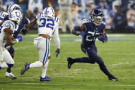 Tennessee Titans running back Derrick Henry (22) carries the ball against Indianapolis Colts free safety Julian Blackmon (32) in the first half of an NFL football game Thursday, Nov. 12, 2020, in Nashville, Tenn. (AP Photo/Wade Payne)