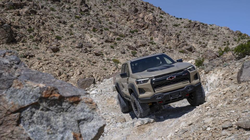 front three quarter view of the 2024 colorado zr2 bison on an off road trail
