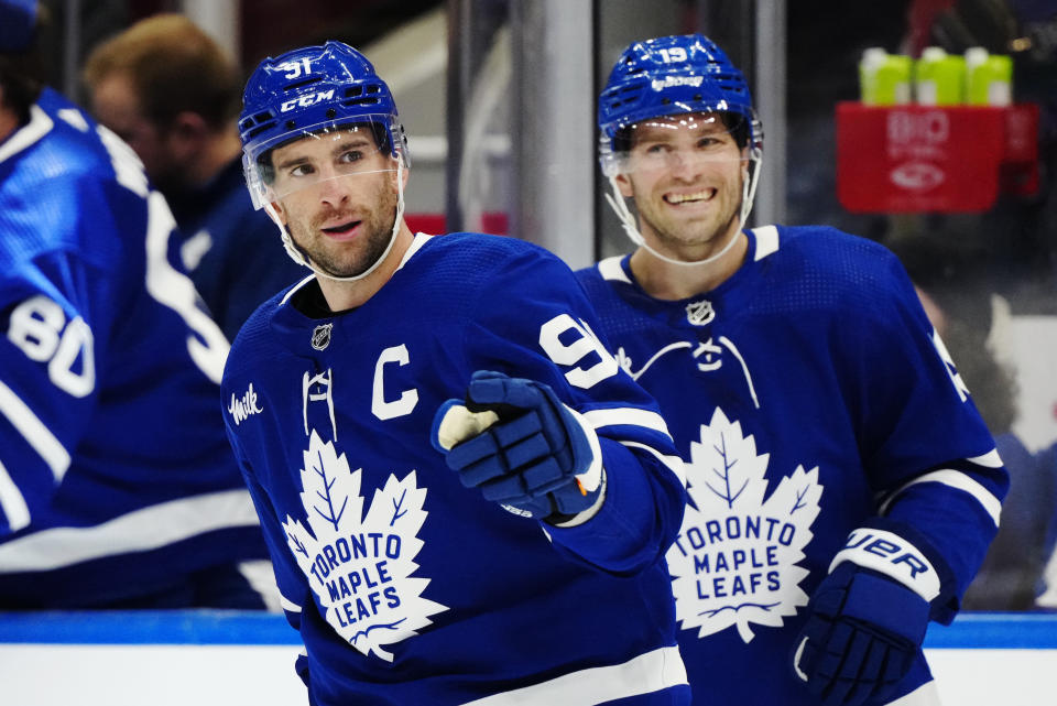 Toronto Maple Leafs' John Tavares (91) celebrates his goal against the New York Rangers with Calle Jarnkrok (19) during the third period of an NHL hockey game in Toronto on Saturday, March 2, 2024. (Frank Gunn/The Canadian Press via AP)