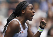 Cori "Coco" Gauff of the U.S. reacts after winning a point against Romania's Sorana Cirstea during their second round singles match at the Australian Open tennis championship in Melbourne, Australia, Wednesday, Jan. 22, 2020. (AP Photo/Lee Jin-man)