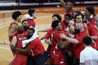Texas Tech guard Mac McClung, front left, who hit the winning shot against Texas in the final seconds of an NCAA college basketball game, celebrates with teammates Wednesday, Jan. 13, 2021, in Austin, Texas. Texas Tech won 79-77. (AP Photo/Eric Gay)
