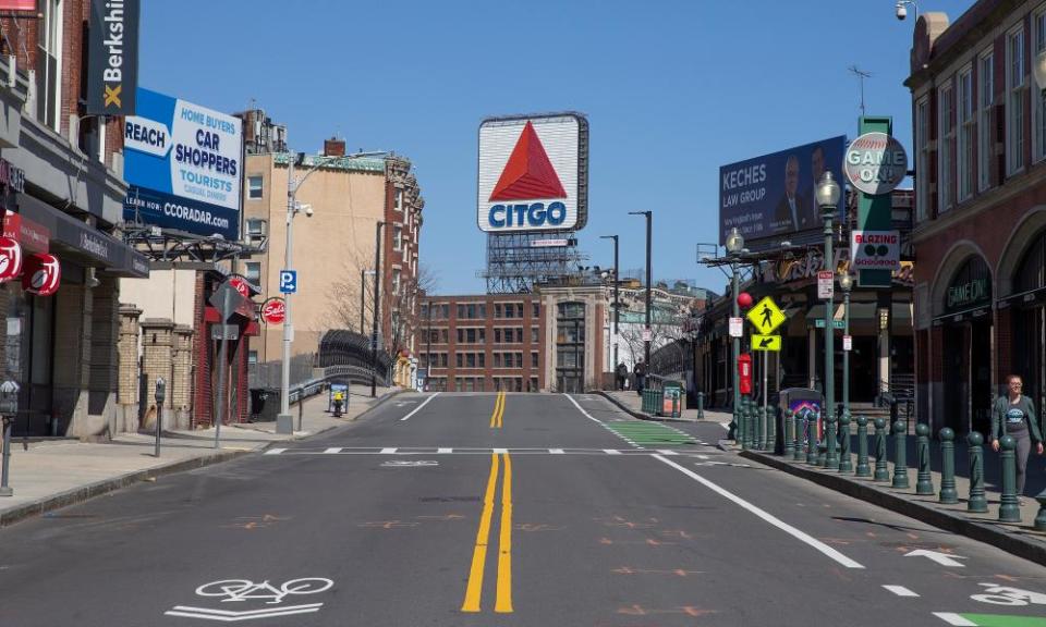 Brookline Avenue outside the closed Fenway Park is empty in Boston on Thursday on what was to be opening day in Major League Baseball. Major sports have been suspended.