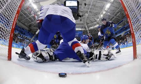 Ice Hockey - Pyeongchang 2018 Winter Olympics - Men’s Playoff Match - Finland v South Korea - Gangneung Hockey Centre, Gangneung, South Korea - February 20, 2018. Juuso Hietanen of Finland scores his team's fourth goal. REUTERS/Julio Cortez