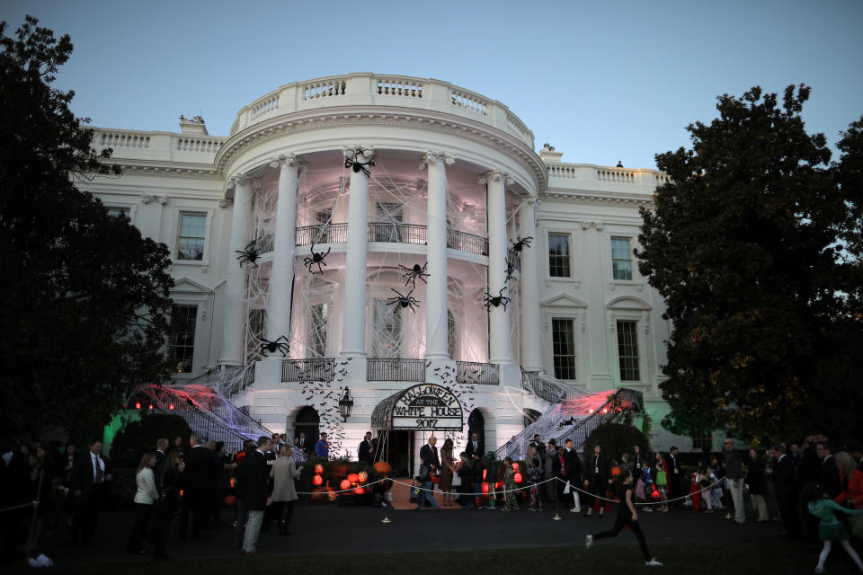 <p>U.S. President Donald Trump and First Lady Melania Trump give out Halloween treats to children at the South Portico of the White House in Washington, D.C. on Oct. 30, 2017. (Photo: Carlos Barria/Reuters) </p>