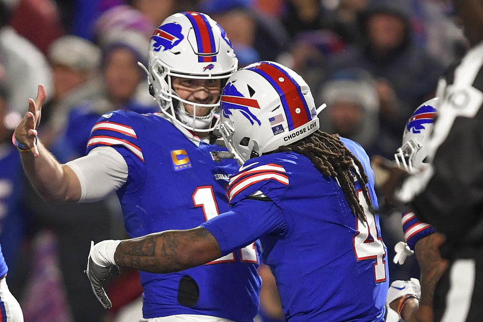 Buffalo Bills running back James Cook (4) celebrates with quarterback Josh Allen (17) after scoring touchdown against the Dallas Cowboys during the second quarter of an NFL football game, Sunday, Dec. 17, 2023, in Orchard Park, N.Y. (AP Photo/Adrian Kraus)