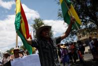 A man shouts next to fellow coca farmers and supporters of Bolivia's ousted President Evo Morales as they stage a blockade of an entrance to Sacaba