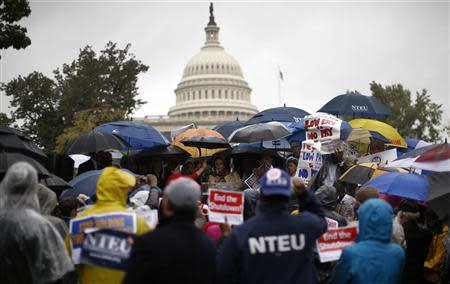 U.S. House Minority Leader Nancy Pelosi (D-CA) addresses protesters calling for an end to the U.S. government shut down on Capitol Hill in Washington, October 10, 2013. REUTERS/Jason Reed