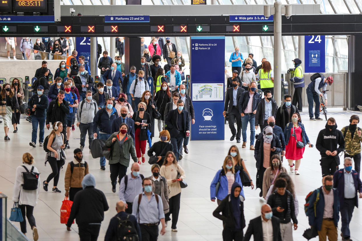 Commuters at London Waterloo railway station. (Hollie Adams/Bloomberg via Getty Images)