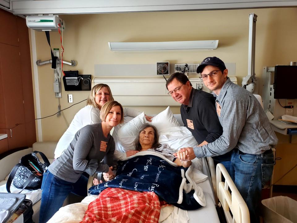 Cheryl Taylor Bagenstose, surrounded by her children and husband during a hospital stay as she battled cancer in April 2022.