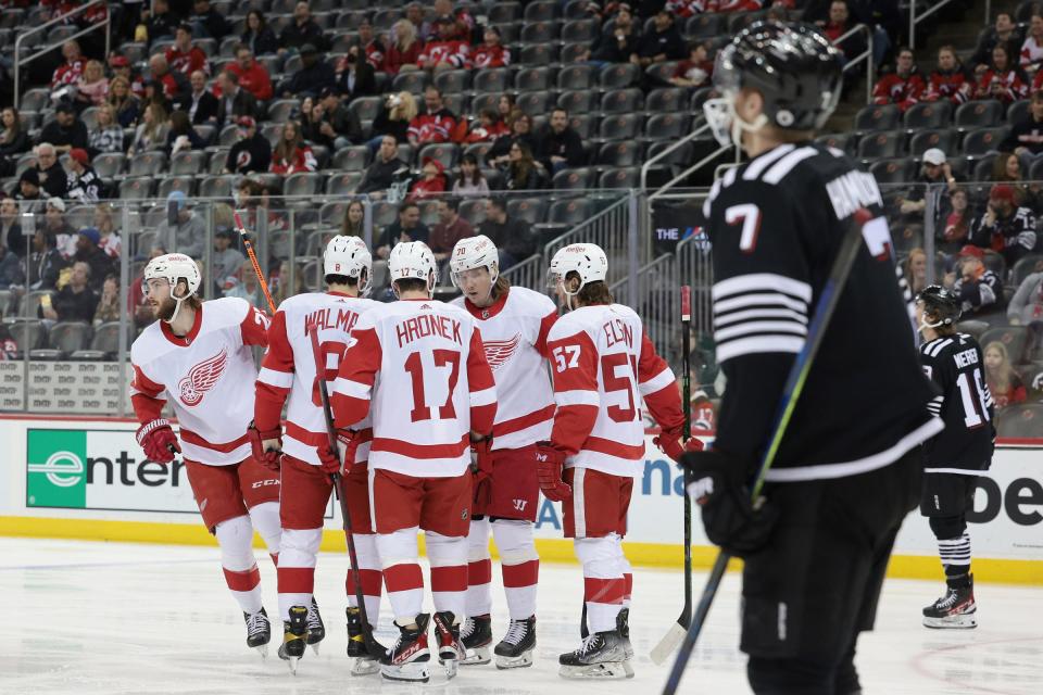 Apr 29, 2022; Newark, New Jersey, USA; Detroit Red Wings center Michael Rasmussen (27) celebrates his goal with teammates during the first period against the New Jersey Devils at Prudential Center. Mandatory Credit: Vincent Carchietta-USA TODAY Sports