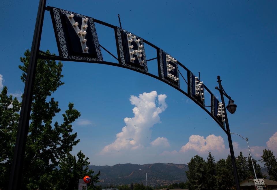 A cloud rises above the McKinney Fire west of Yreka on Tuesday, Aug. 2, 2022, as the blaze continues to burn in steep terrain in western Siskiyou County. Yreka and the surrounding area had been blanketed by thick smoke during a weather inversion layer.