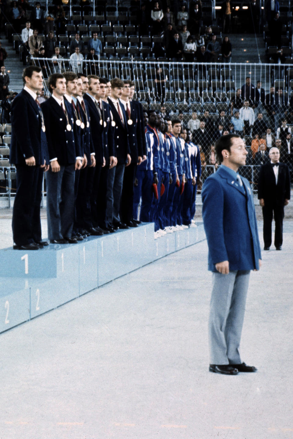 FILE - The Soviet Union basketball team stands on the podium after receiving the Olympic gold medal Sept. 10, 1972, in Munich, flanked by the bronze-winning Cubans, right, and a vacant place where the U.S. team, officially given the Olympic silver, was supposed to appear. Members of the 1972 U.S. Olympic men's basketball team have talked about finally retrieving those silver medals they vowed to never accept. No, they still don't want them for themselves. They believe the medals belong in the Naismith Memorial Basketball Hall of Fame, but the latest attempt to get them from the International Olympic Committee has been thwarted.(Pool photo via AP, File)