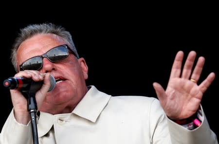 FILE PHOTO: Suggs, lead singer of the British band Madness, performs on The Pyramid stage at Worthy Farm in Somerset during the Glastonbury Festival