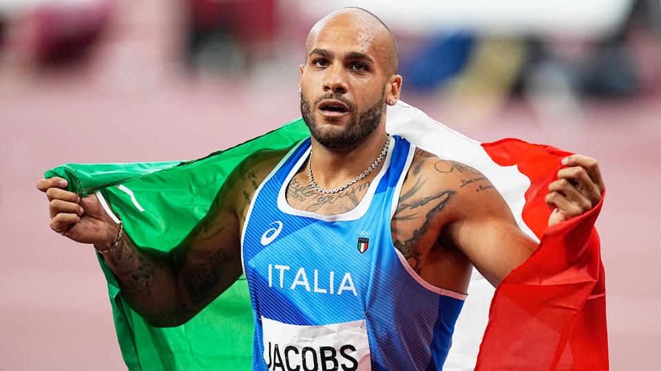 Marcell Jacobs (pictured) holds a flag as he celebrates his gold medal at the Tokyo Olympics.