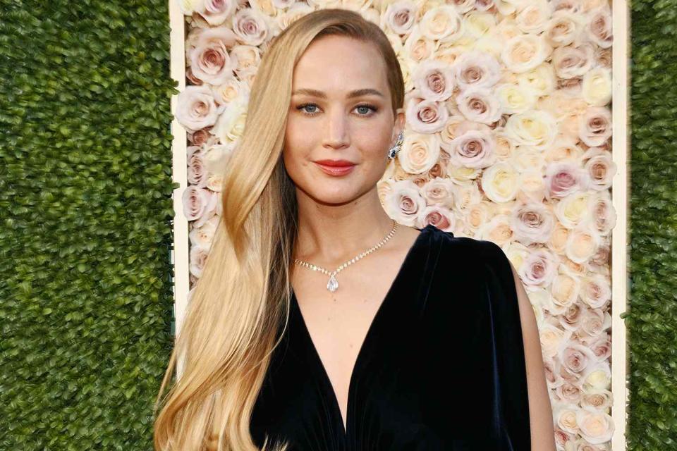 <p>Michael Buckner/Golden Globes 2024/Golden Globes 2024 via Getty</p> Jennifer Lawrence on the red carpet at the Golden Globes 