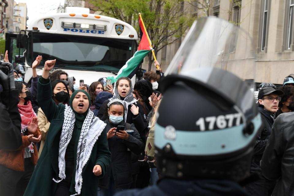 Pro-Palestinian demonstrators gather as the NYPD loads buses with arrested Columbia University students. Matthew McDermott