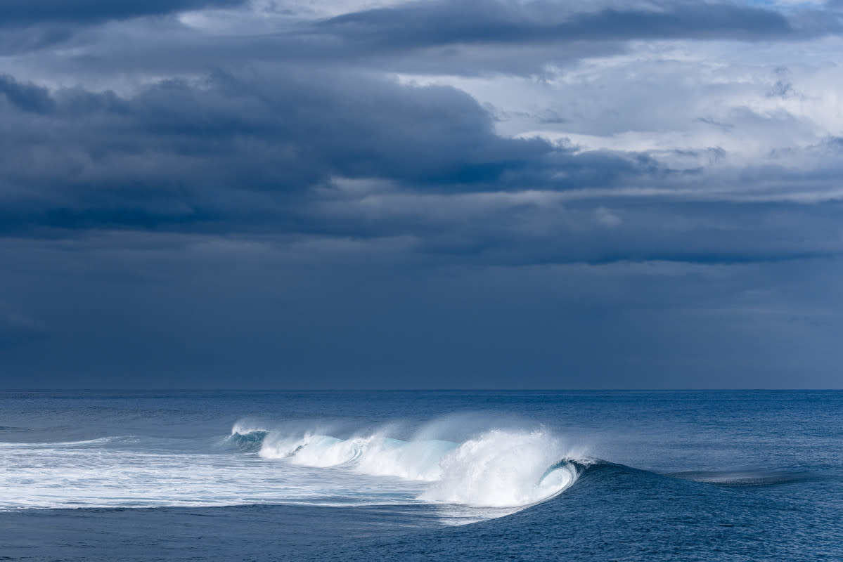 Some of my favorite light to shoot at Teahupo’o is the mid morning sun with dark rain clouds in the back. The morning was more slow than the second half of the day but still had its moments.<p>Photo: Ryan "Chachi" Craig</p>