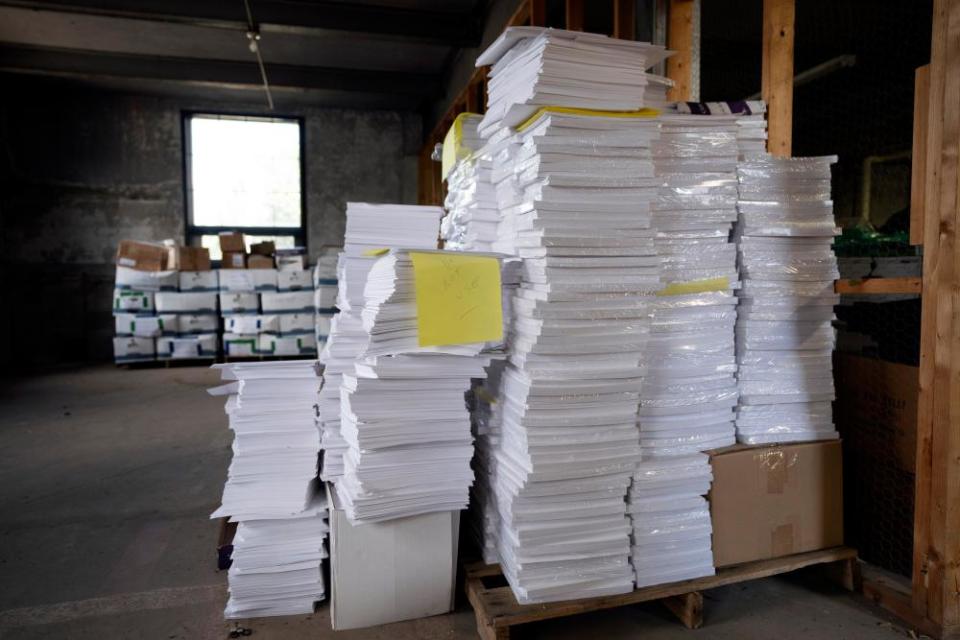 Stacks of paper too thick for Luzerne county’s election equipment are seen in the county’s warehouse in Wilkes-Barre.