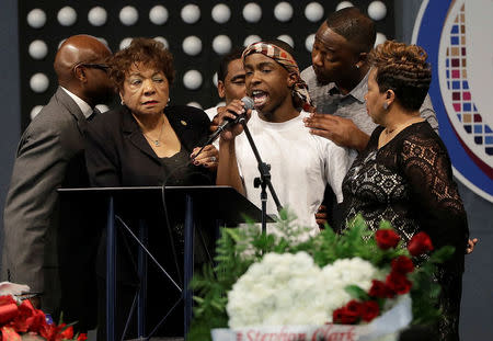 Stevante Clark (C), speaks during the funeral services for Stephon Clark at Bayside Of South Sacramento Church in Sacramento, California, U.S., March 29, 2018. Jeff Chiu/Pool via Reuters