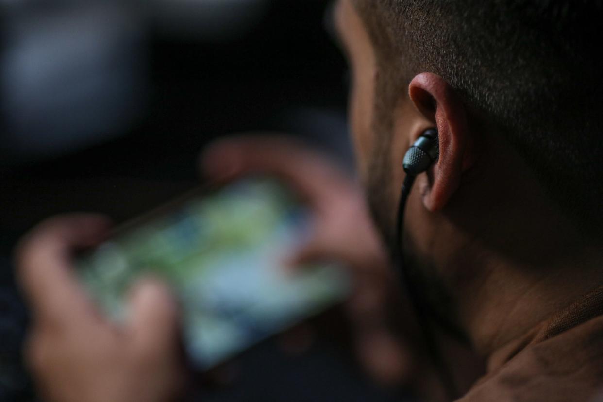 Salman Ahmad, gaming streamer, during a live game streaming at the S8UL gaming house in Navi Mumbai, India, on Friday, July 22, 2022. Equipped with bunkbeds, cubicles and a kitchen with a full-time chef, the S8UL gaming house is one of many popping up around the country -- testament to the explosive growth of an industry that's attracting investment from around the world. (Dhiraj Singh/Bloomberg)