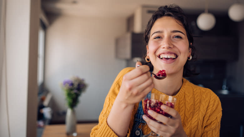 Woman eating pomegranates