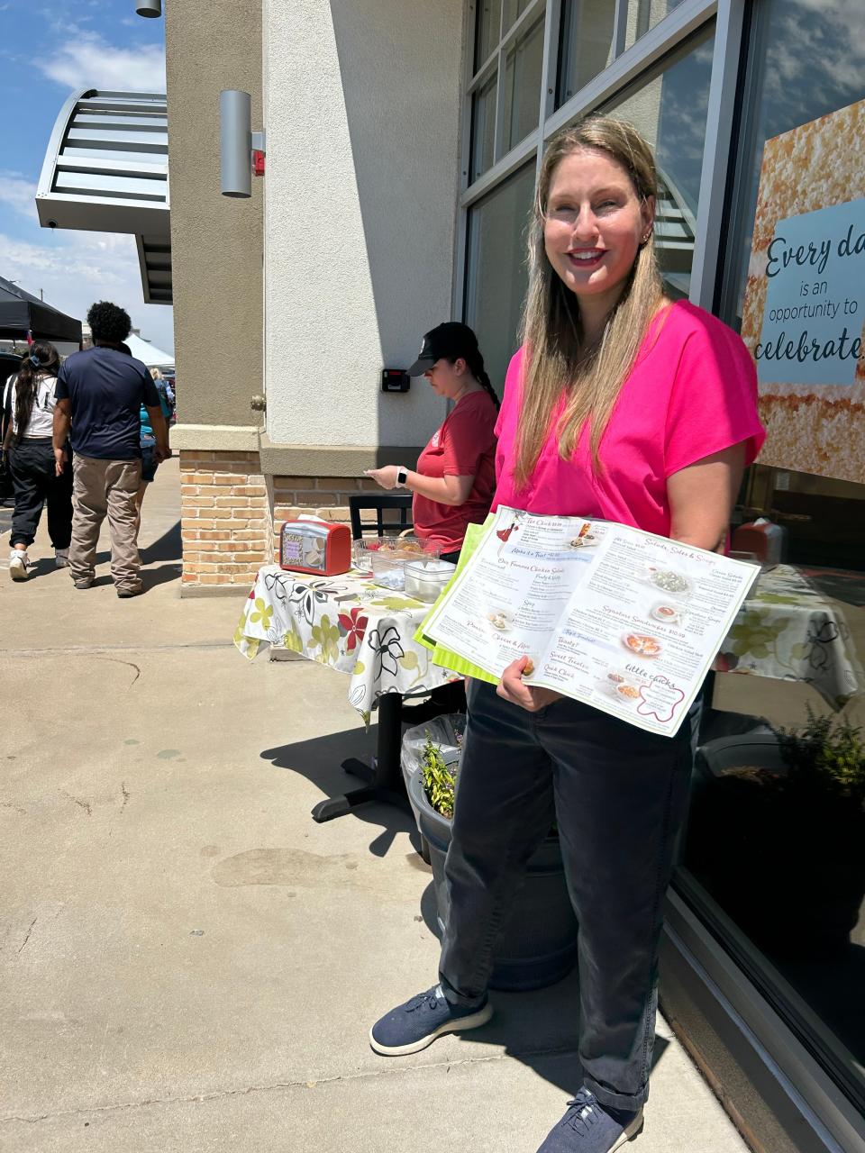 Owner of the new Chicken Salad Chick restaurant, Laura Garrison, promotes new dishes including a Dill Chicken Salad at the Wolflin Square event Friday. Garrison said the restaurant has been so successful it is going to Lubbock soon. A raffle for a $250 Visa card will be held in July to celebrate their first anniversary success.