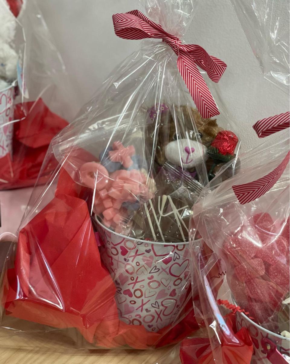 A stuffed bear awaits a loving home at Minty's Candies & Treats in Norwich, just one of the many shops prepping their sugary fare for a festive Valentine's Day holiday.