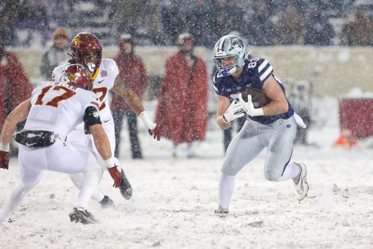 Kansas State tight end Will Swanson (83) looks for running room against Iowa State's Beau Freyler (17) during last year's regular season finale at Bill Snyder Family Stadium.