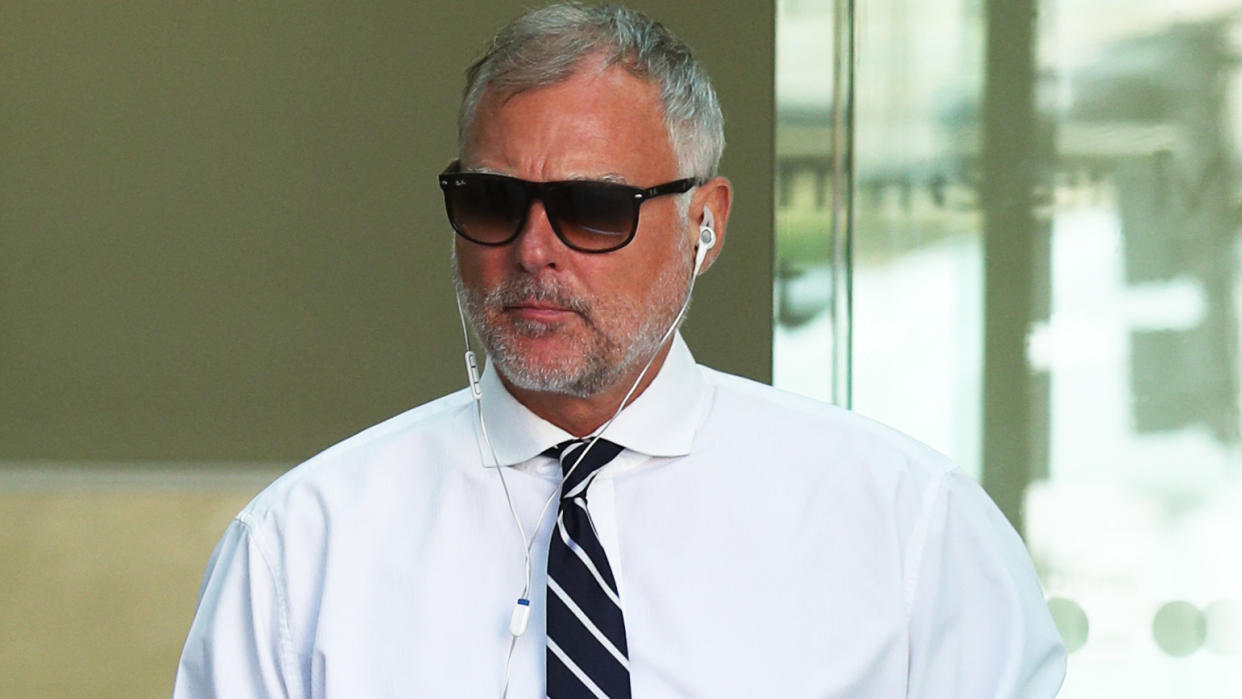 John Leslie leaving Westminster Magistrates' Court after appearing charged with sexually assaulting a woman more than a decade ago (Credit: PA)