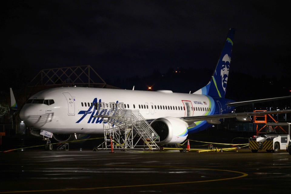 A plastic sheet covers an area of the fuselage of the Alaska Airlines N704AL Boeing 737 MAX 9 aircraft outside a hangar at Portland International Airport on 8 January 2024 in Portland, Oregon. (Getty Images)