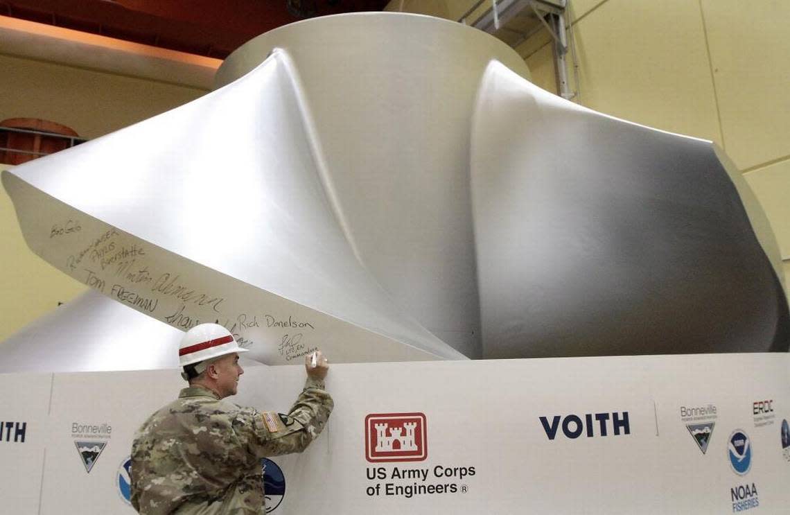 Lt. Col. Timothy Vail, then commander of the Walla Walla District of the Army Corps of Engineers, signs a new fish-friendly and high efficiency turbine at Ice Harbor Dam on the Snake River in 2016.