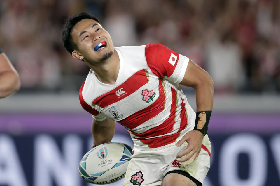 FILE - In this Oct. 13, 2019, file photo, Japan's Kenki Fukuoka scores a try during the Rugby World Cup Pool A game at International Stadium against Scotland in Yokohama, Japan. Fukuoka will retire after playing for the Panasonic Wild Knights against Suntory Sungoliath in the final of Japan's Top League club competition on Sunday May 23. (AP Photo/Jae Hong, File)