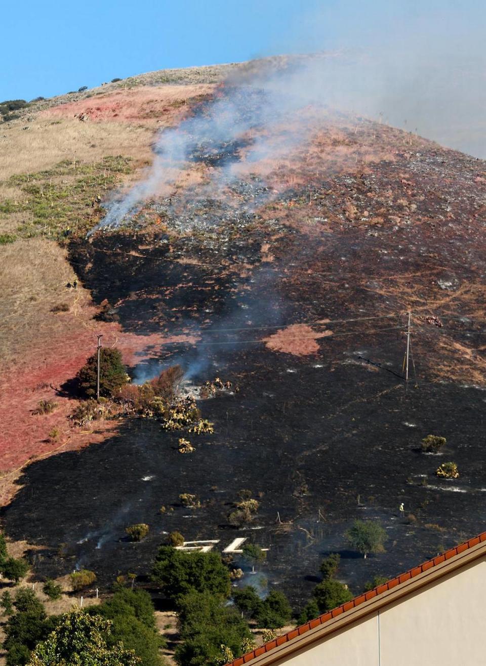 A fire burns the hillside off Lizzie Street behind San Luis Obispo High School on Monday, Oct. 30, 2023.