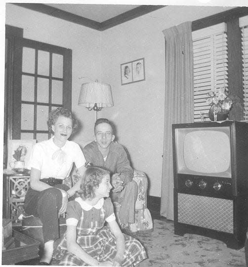 Gregory Phelps' parents and sister with the TV the family purchased from the Hamilton Store in 1953.